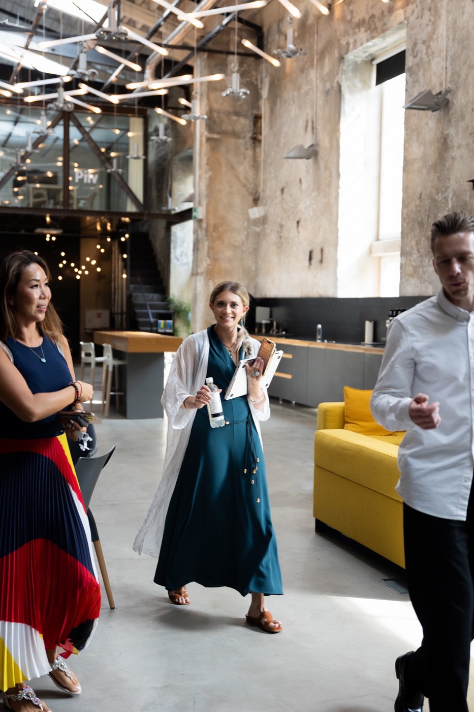Sabrina Stocker mid-stride, talking to a room of founders